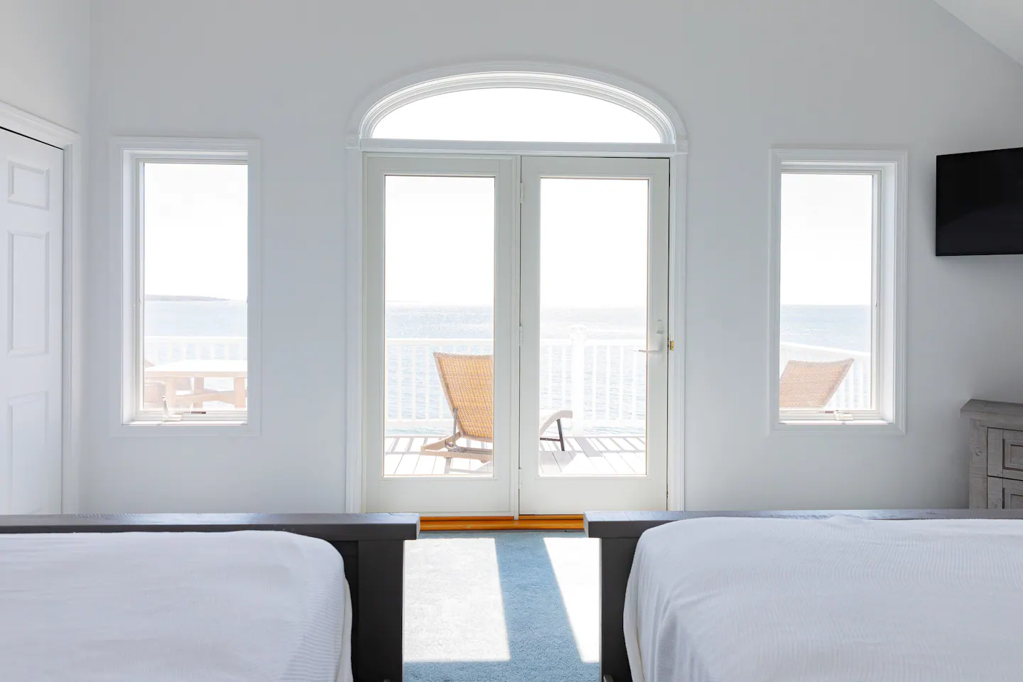 Bedroom 2 on the second level has two queen beds, a huge wardrobe, a 42" HDTV, a cathedral ceiling, and access to a furnished balcony with solar illumination.