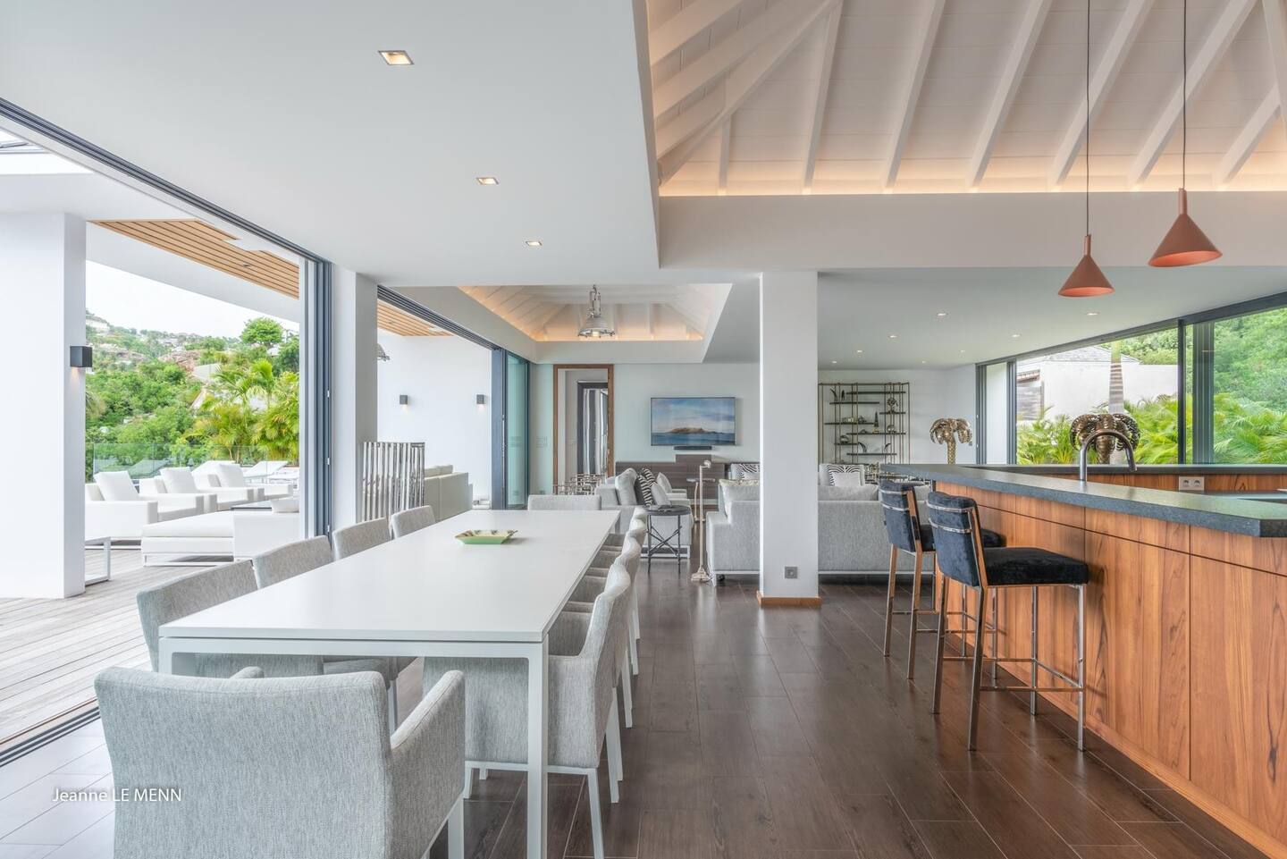 There are ten-person eating tables both inside and outside.