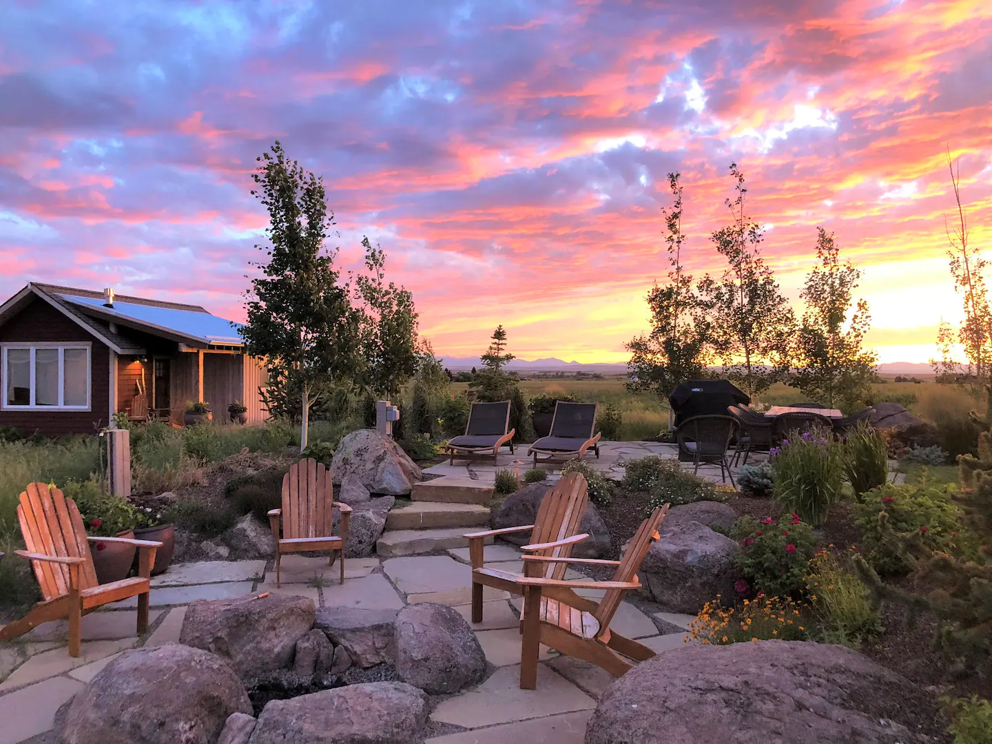 Two communal fire pits with grills and patio furniture serve all the cabins.