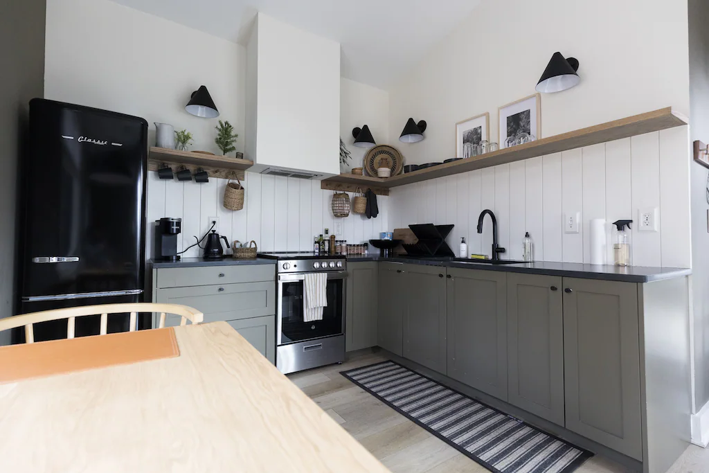 Find everything you need to cook and bake inside Aspen Haus's modern and rustic designer kitchen, complete with pots, pans, utensils of all kinds and basic spices.