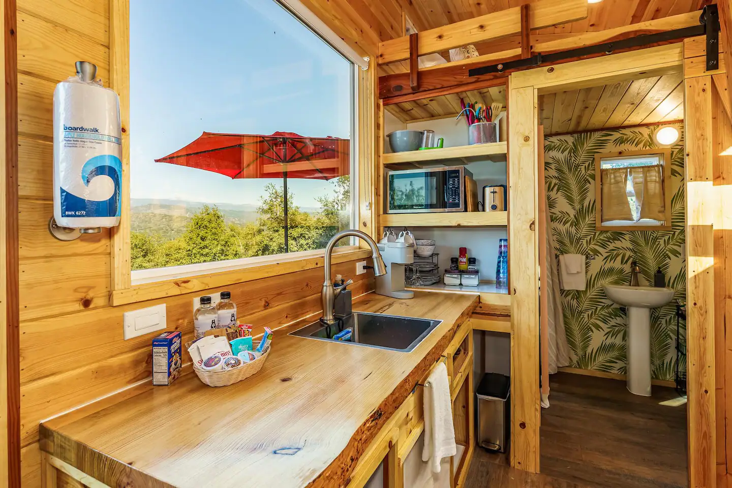 Image of the kitchen and restroom with sliding barn door!