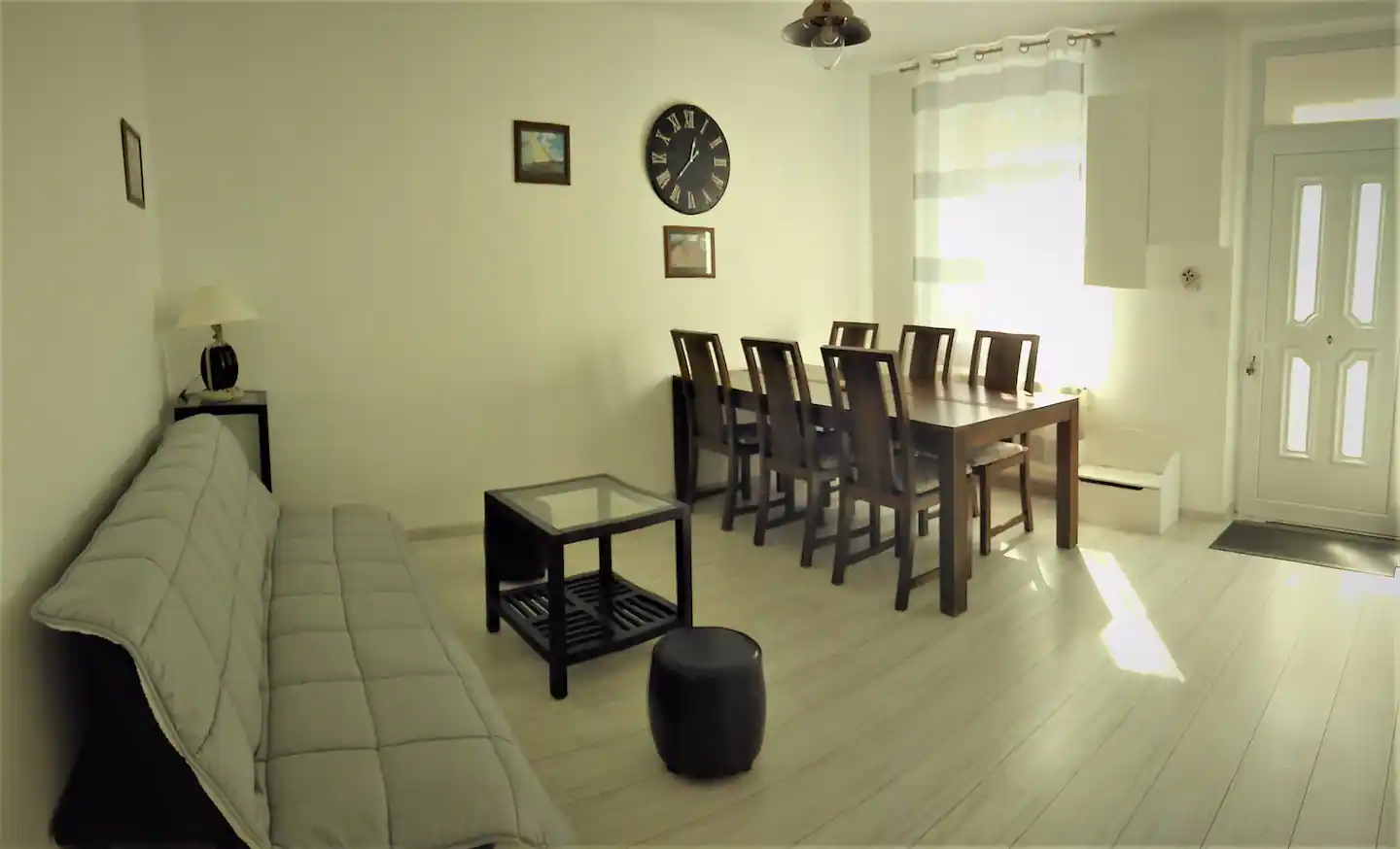 A living room with its own kitchen