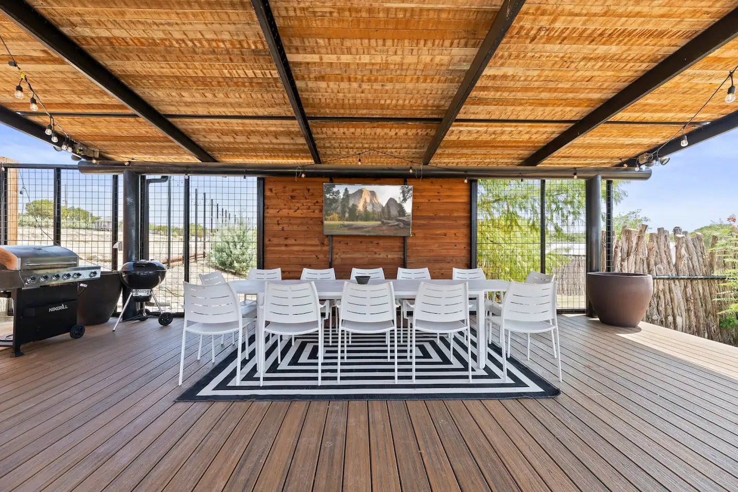 There is an outdoor dining area that can accommodate up to twelve people.