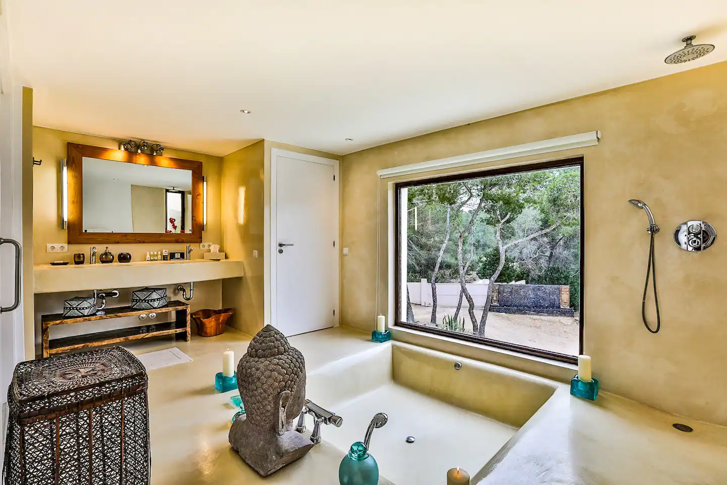 A luxurious and fully-equipped bathroom with modern fixtures, a spacious bathtub, and a sleek glass-enclosed shower.