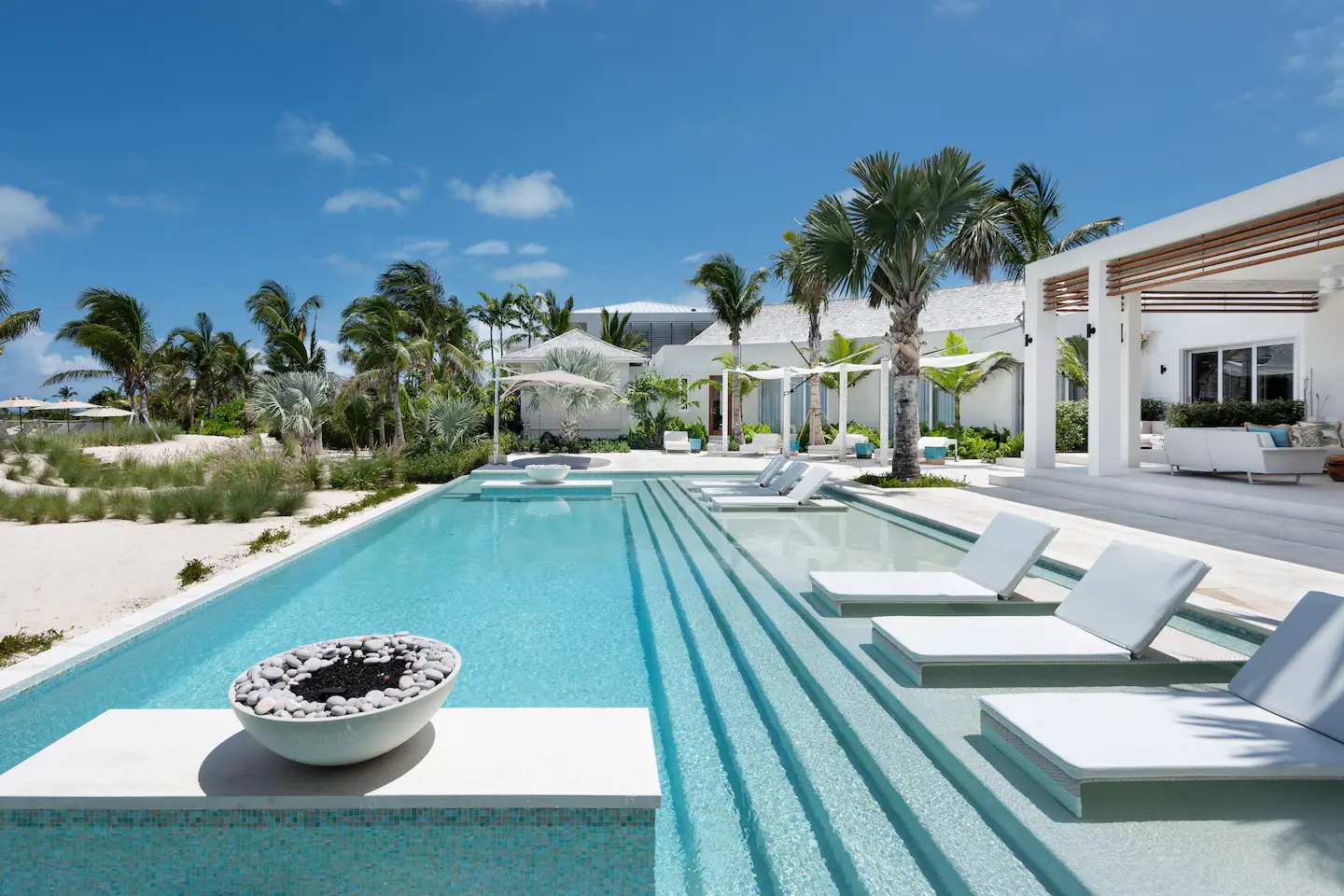 A butler will bring you refreshments to your floating lounger in the infinity pool.